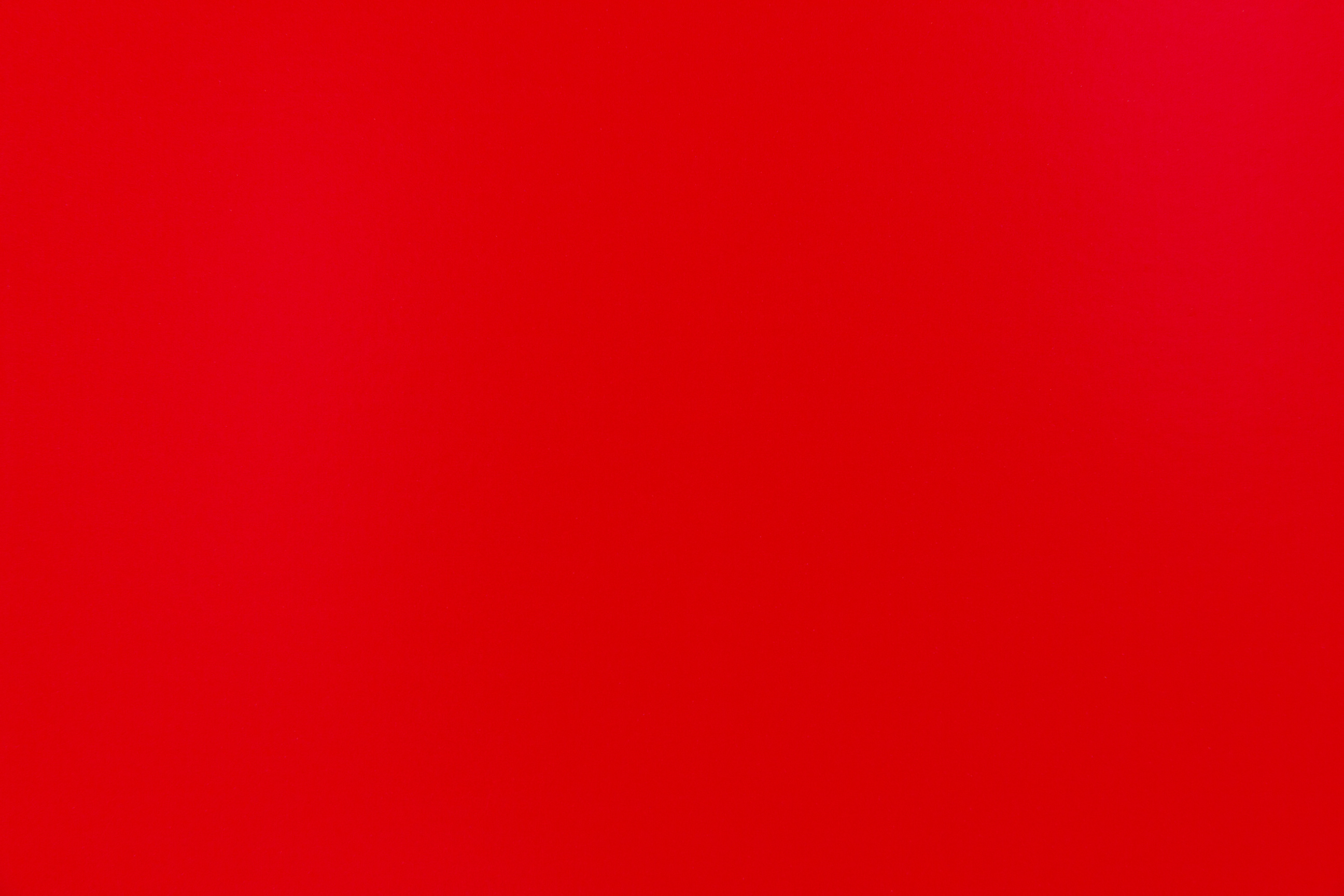 Bright red cardboard sheet surface